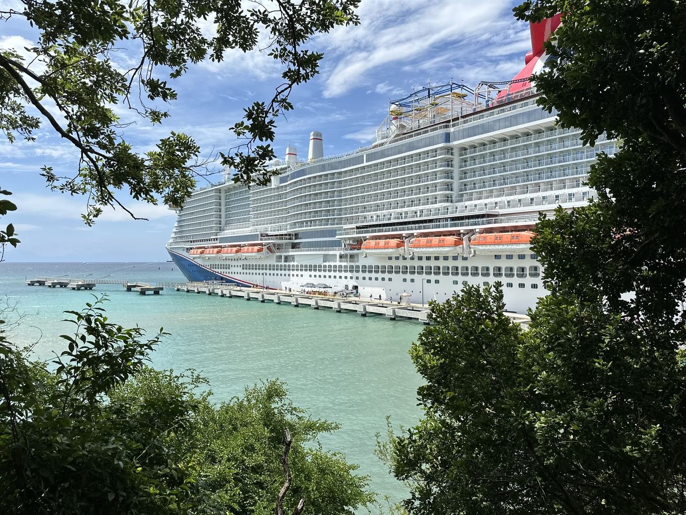 Cruise ship docked at a tropical port